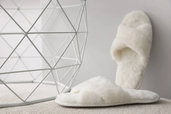 Soft Fluffy White Slippers Grey Wall — Stock Photo, Image