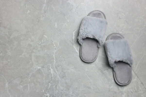 Pair Soft Slippers Grey Marble Floor Top View Space Text — Foto Stock