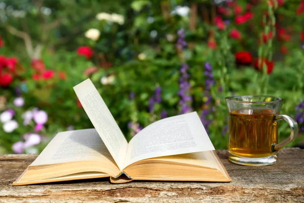 Open Book Glass Cup Tea Wooden Table Garden — Stock Fotó
