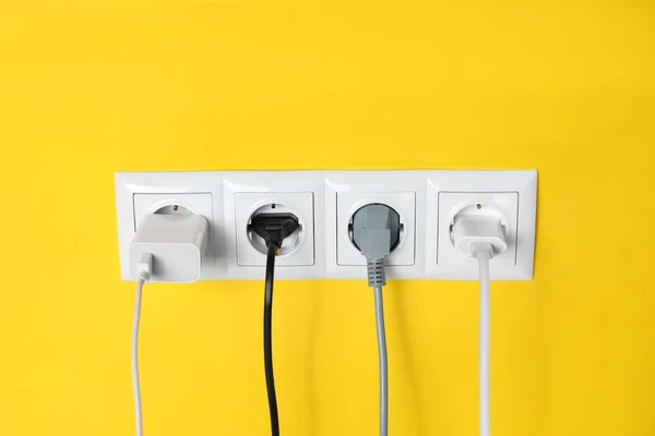 Power Sockets Inserted Plugs Yellow Wall Electrical Supply — Foto de Stock