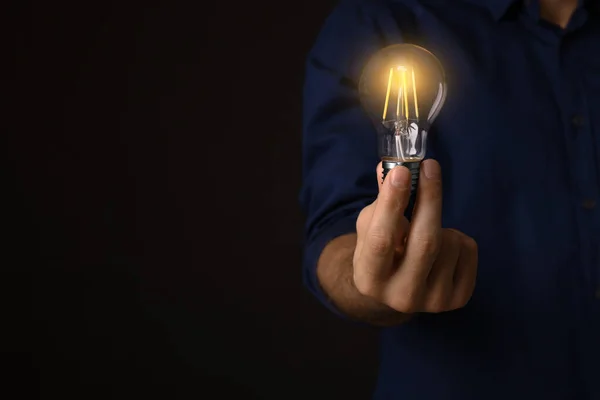 Glow Your Ideas Closeup View Man Holding Light Bulb Black — Stock Photo, Image