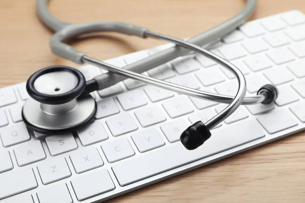 Computer Keyboard Stethoscope Wooden Table Closeup — 图库照片