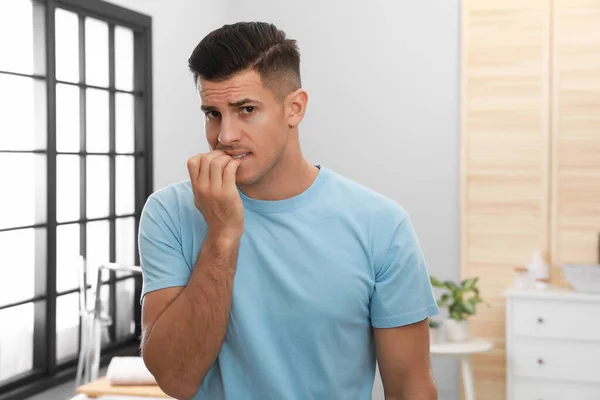 Man Biting His Nails Indoors Bad Habit — 图库照片