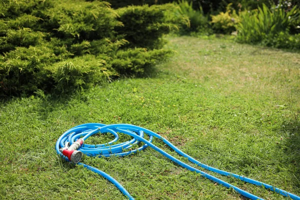 Watering Hose Sprinkler Green Grass Outdoors Space Text — 图库照片