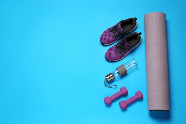Exercise Mat Dumbbells Bottle Water Shoes Turquoise Background Flat Lay — Stock Photo, Image