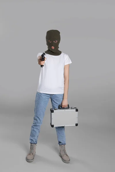 Woman Wearing Knitted Balaclava Metal Briefcase Gun Grey Background — Stock Photo, Image