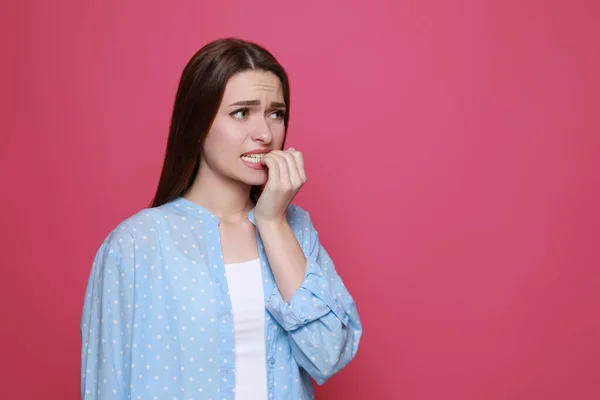 Young Woman Biting Her Nails Pink Background Space Text — Φωτογραφία Αρχείου