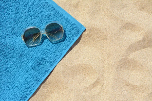 Soft Blue Beach Towel Sunglasses Sand Top View Space Text — 스톡 사진