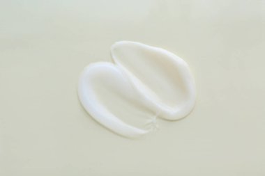 Işık arka planında vücut kremi örneği, üst görünüm