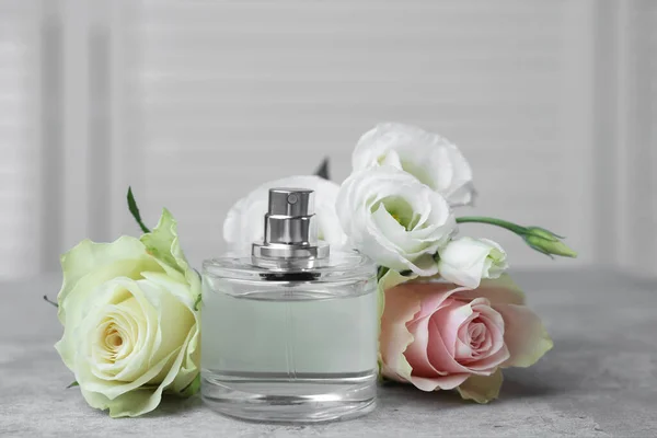 Bottle Perfume Flowers Grey Table Indoors — Foto de Stock