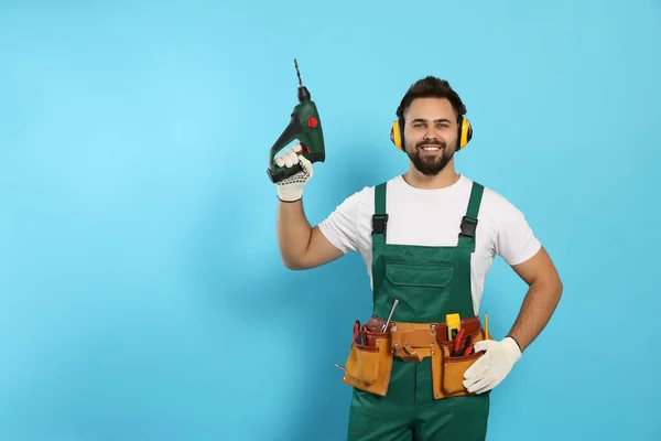 Young Worker Uniform Power Drill Light Blue Background Space Text — Stockfoto