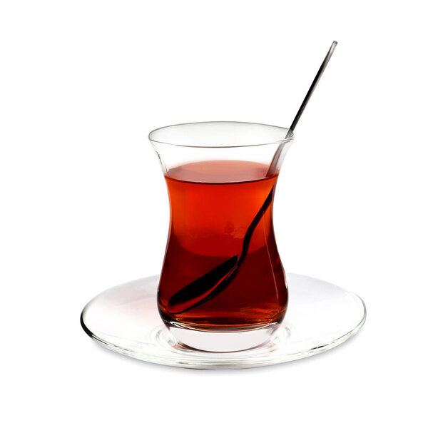 Glass of traditional Turkish tea with spoon isolated on white