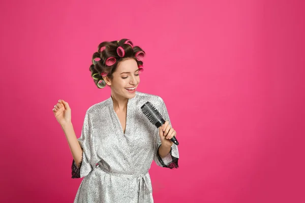 Beautiful Young Woman Silk Bathrobe Hair Curlers Singing Hairbrush Pink — Stock fotografie