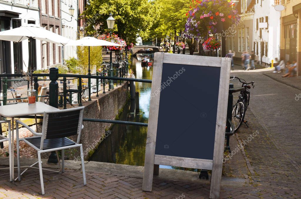Blank advertising board on city street. Space for design
