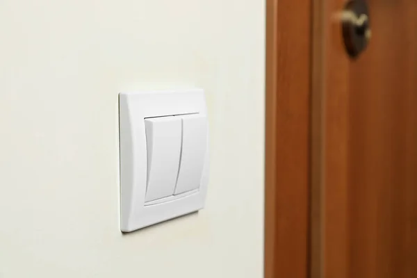 Modern Plastic Light Switch White Wall Indoors Closeup — Stock Photo, Image