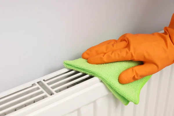 Woman Cleaning Radiator Rag Indoors Closeup Space Text — стоковое фото