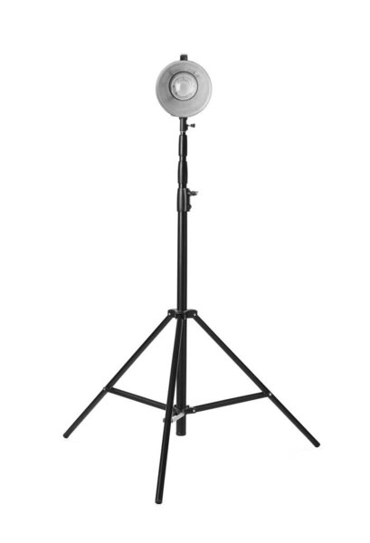 Studio flash light on tripod against white background. Professional photographer's equipment