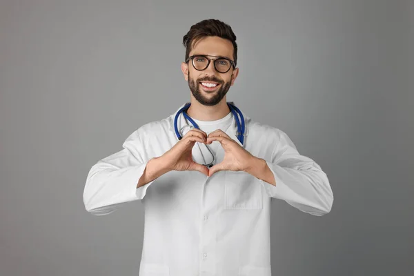 Doctor Making Heart Hands Grey Background — Stok fotoğraf