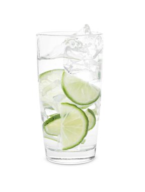 Water with sliced lime splashing out of glass on white background