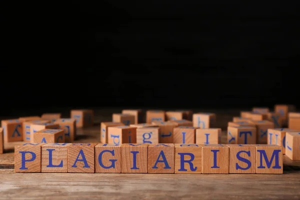 Wooden Cubes Word Plagiarism Table Space Text — ストック写真