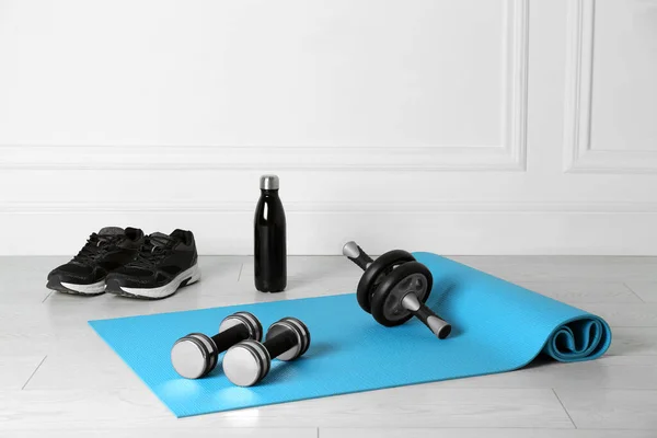 Exercise Mat Dumbbells Roller Shoes Bottle Water Light Wooden Floor — Foto de Stock