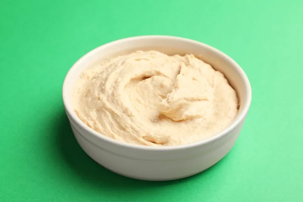 Bowl Tasty Hummus Green Background — Stock Photo, Image