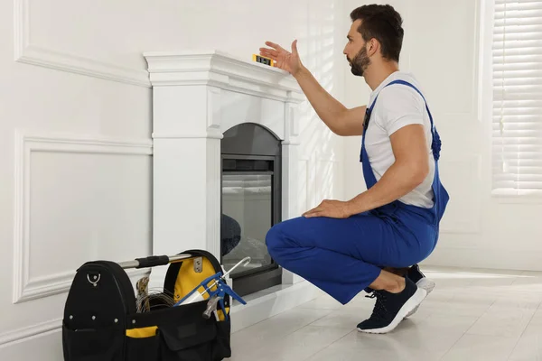Professional Technician Installing Electric Fireplace Room — стоковое фото