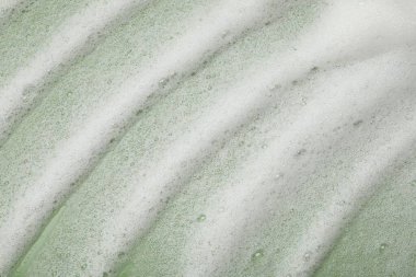 Zeytin zemininde beyaz yıkama köpüğü, üst görünüm