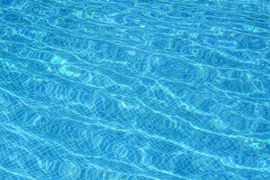 Clear refreshing water in swimming pool on sunny day, closeup