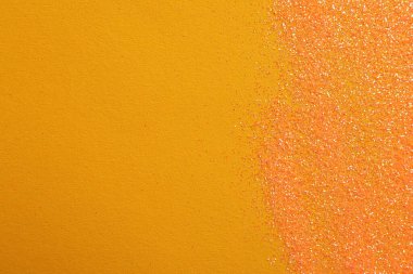 Turuncu arka planda parlak parlak parıltı, düz yatış. Metin için boşluk