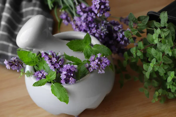 Mortar Fresh Lavender Flowers Mint Pestle Wooden Table Closeup — Zdjęcie stockowe