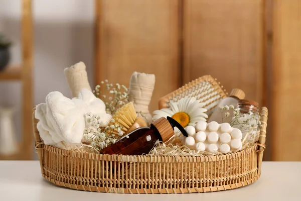 Spa gift set with different products on white table in bathroom