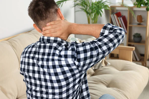 Man Suffering Neck Pain Indoors Back View — Foto Stock
