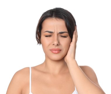 Young woman suffering from ear pain on white background clipart