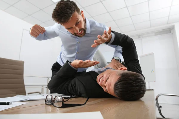 Emotional colleagues fighting in office. Workplace conflict