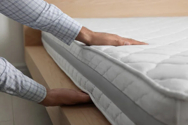 Man Touching Soft White Mattress Indoors Closeup — Stock Photo, Image