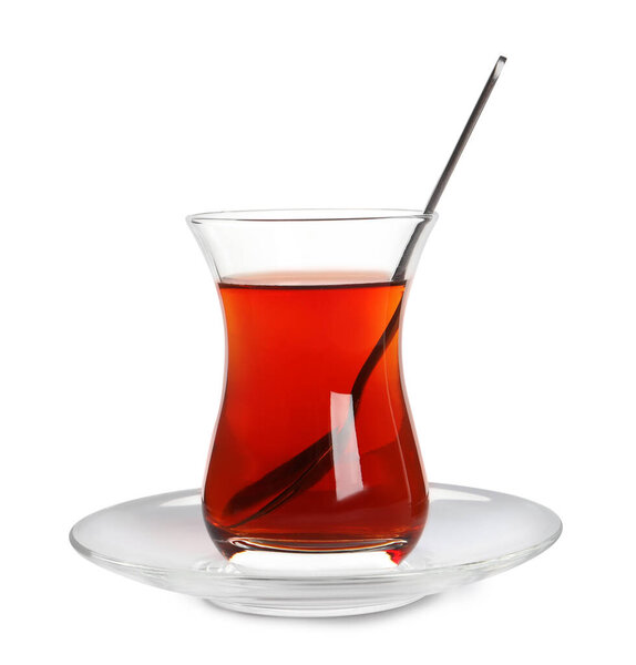 Glass of traditional Turkish tea with spoon isolated on white