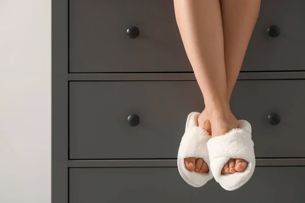 Woman Soft Slippers Sitting Chest Drawers Closeup — Stock Photo, Image