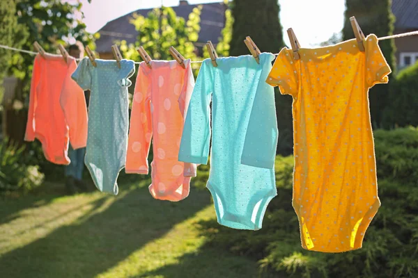 Baby Bodysuits Drying Washing Line Outdoors — Stock Photo, Image