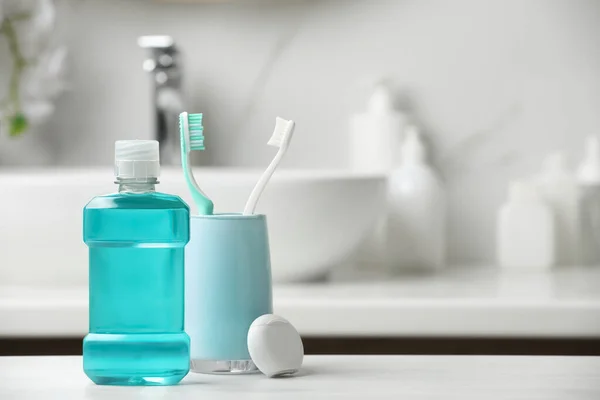 Mouthwash Toothbrushes Dental Floss White Countertop Bathroom Space Text — Stock Photo, Image