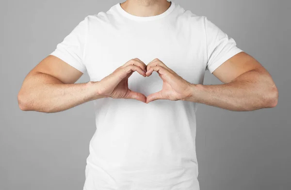 Man Making Heart Hands Grey Background Closeup — Stock fotografie
