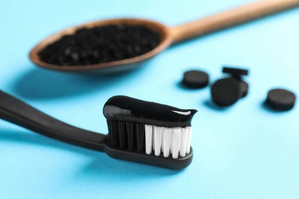 Brush Charcoal Toothpaste Light Blue Background Closeup — Stock Photo, Image