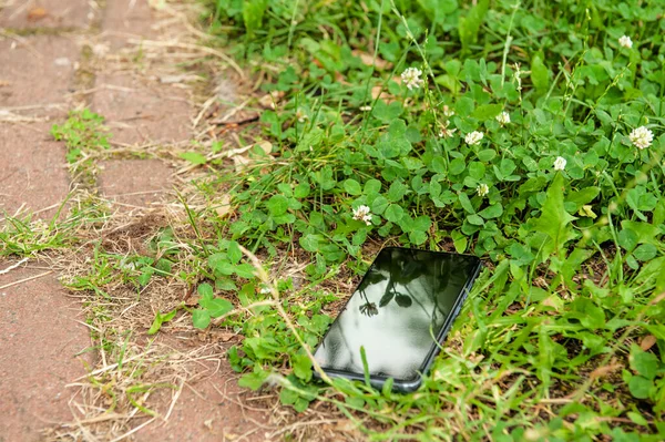 Smartphone Lying Grass Pavement Outdoors Lost Found — Stock Photo, Image