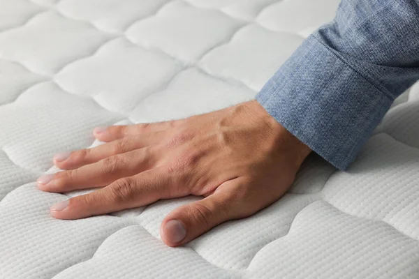 Man Touching Soft White Mattress Closeup View — Stockfoto