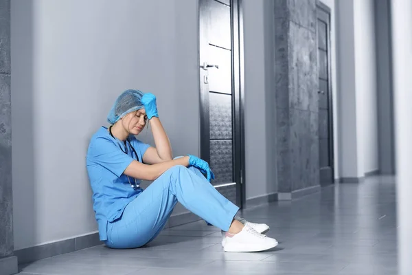 Exhausted Doctor Sitting Floor Hospital Space Text — Foto de Stock