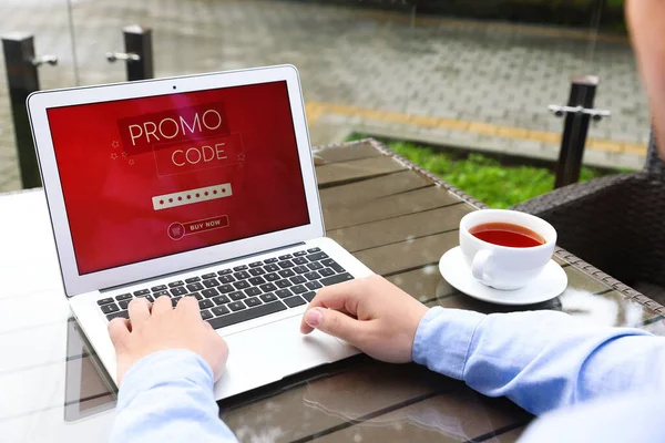 Man Laptop Activating Promo Code Wooden Table Outdoors Closeup — Stock Photo, Image