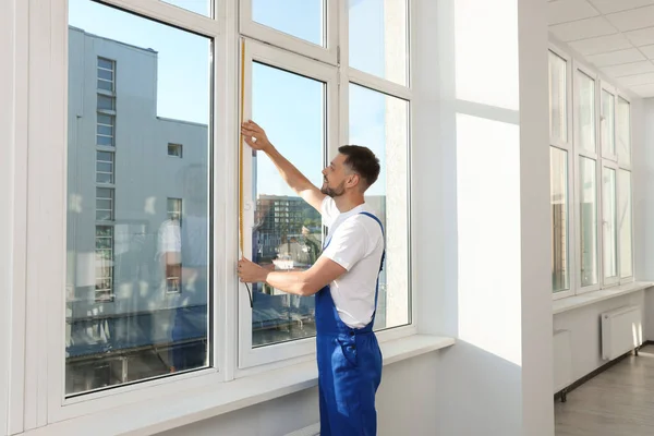 Worker Measuring Plastic Window Indoors Installation Process — Stockfoto