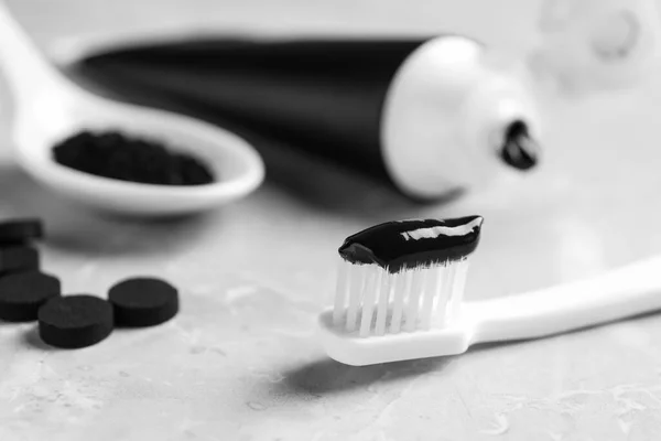Brush Charcoal Toothpaste Light Grey Table Closeup — Stock Photo, Image
