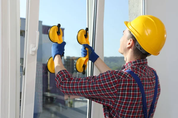 Worker Using Suction Lifters Plastic Window Installation Indoors — 图库照片