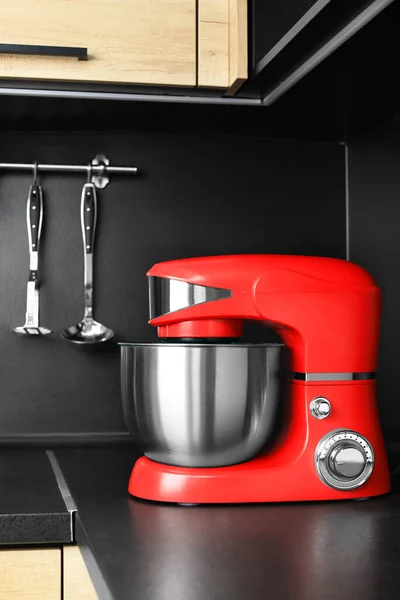Modern stand mixer on countertop in kitchen. Home appliance
